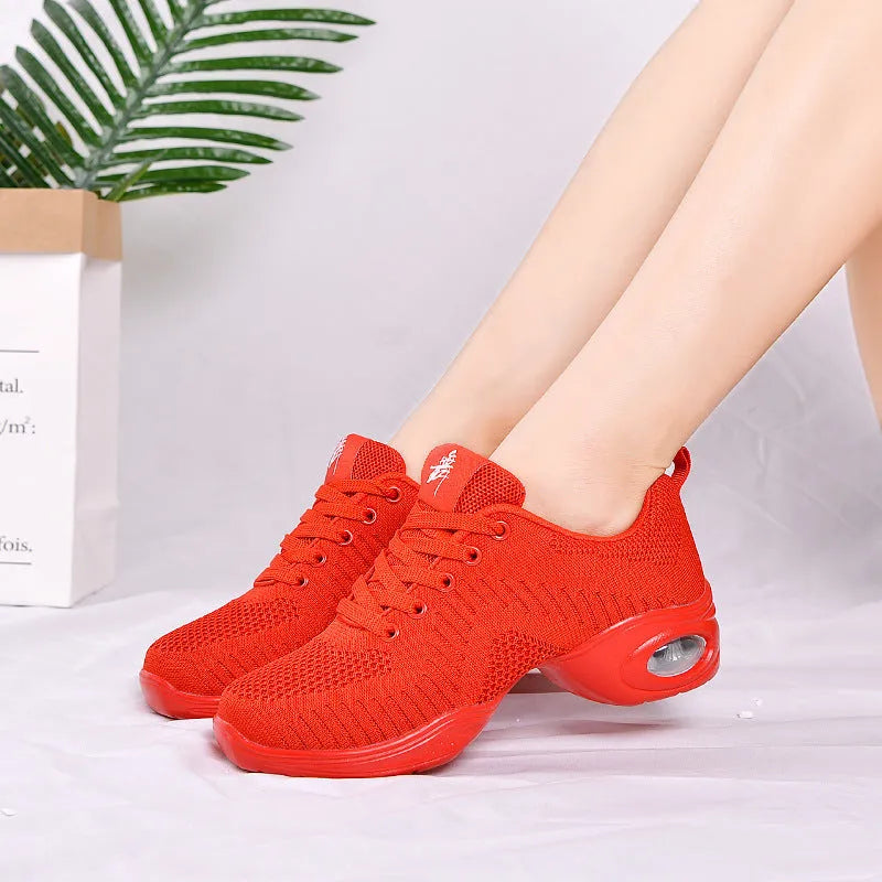 Women's white breathable fly woven mesh dance shoes with a soft PU sole on a light background.