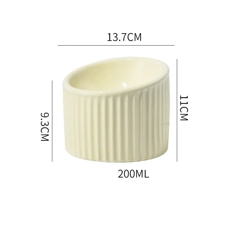 Ceramic elevated cat bowl in round tilted design with raised height for indoor cats