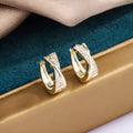 Geometric copper earrings with 14K yellow zircon-treated finish