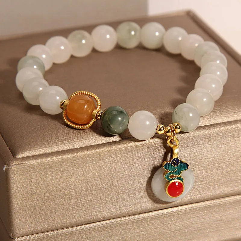 Ice jade bracelet with pearl decoration and Xiangyun peace buckle for women