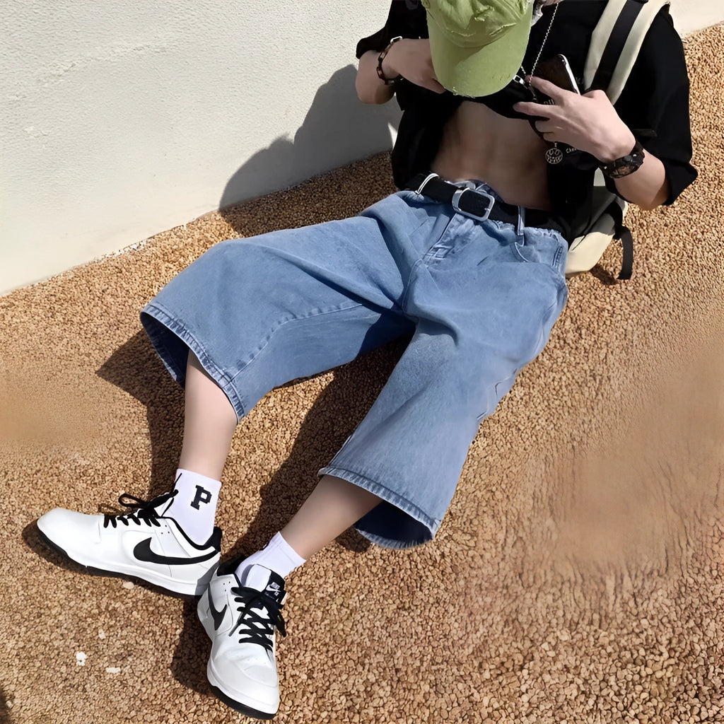 Men's washed light blue denim pirate shorts with a high waist and straight cropped legs on a plain background.