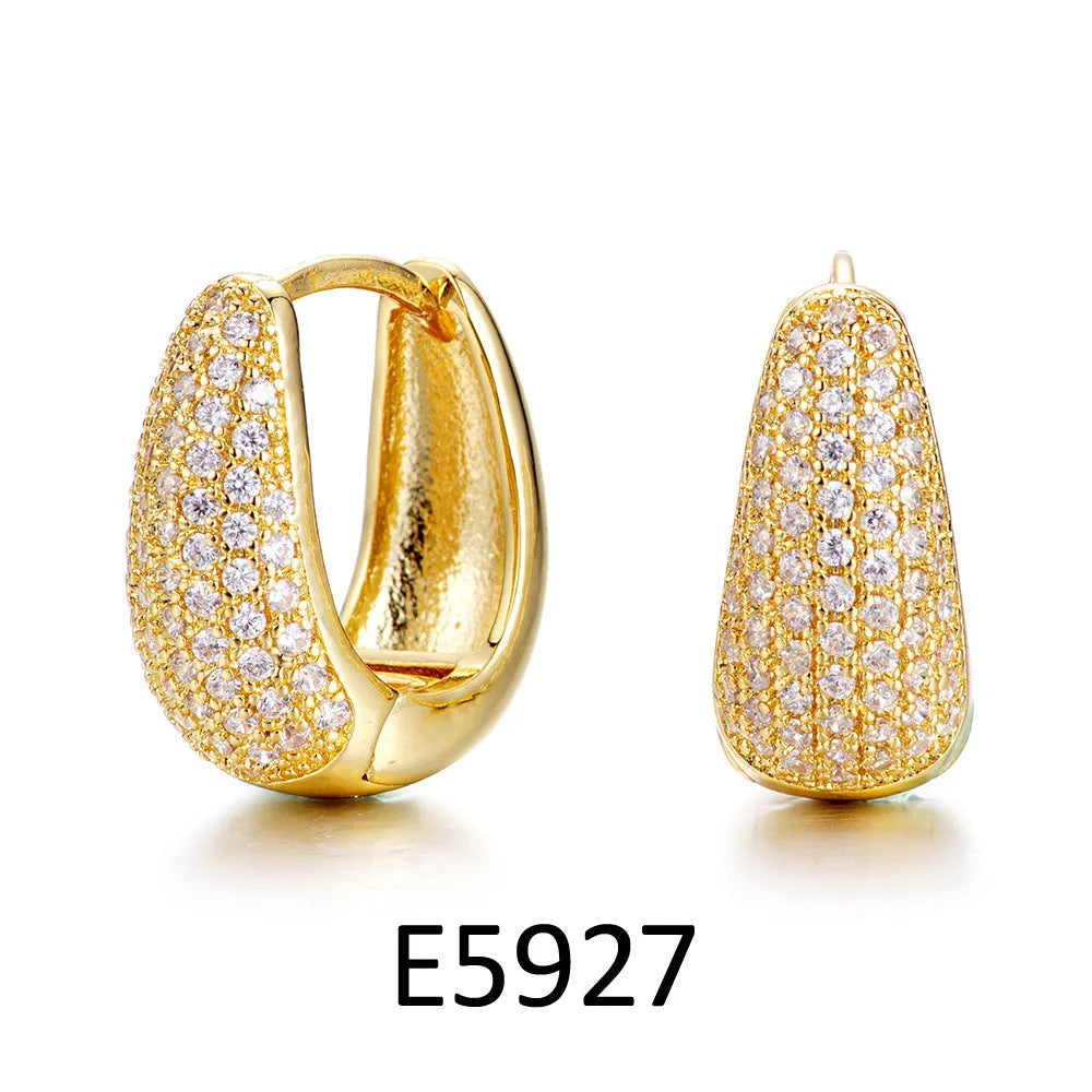 Copper heart-shaped ear clip earrings with gold electroplating and zircon stone accents