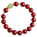 Purple gold sand cinnabar bead bracelet with geometric ellipse shapes on a wrist.
