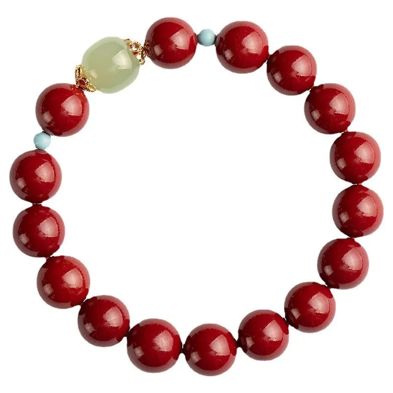 Purple gold sand cinnabar bead bracelet with geometric ellipse shapes on a wrist.