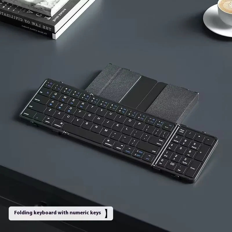 Black folding Bluetooth keyboard with touchpad option showing compact folded size
