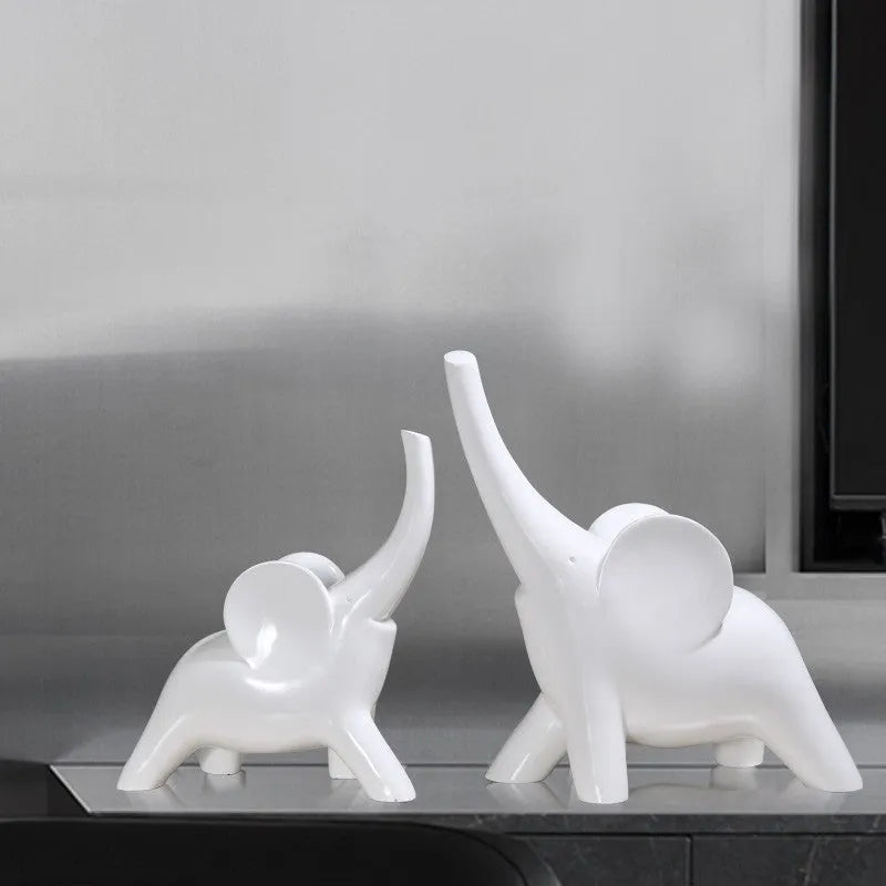 Modern resin elephant ornament in rose gold or white colour, available in large and small sizes.