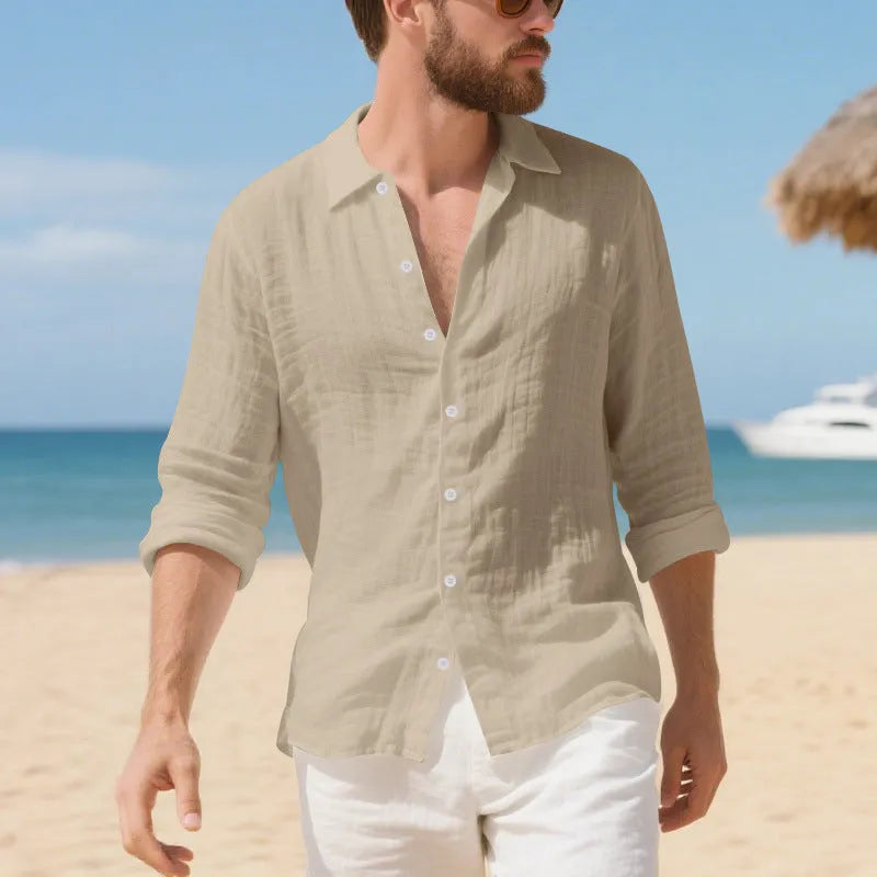 Men's loose fit linen Hawaiian casual shirt on a hanger, shown in light blue colour.