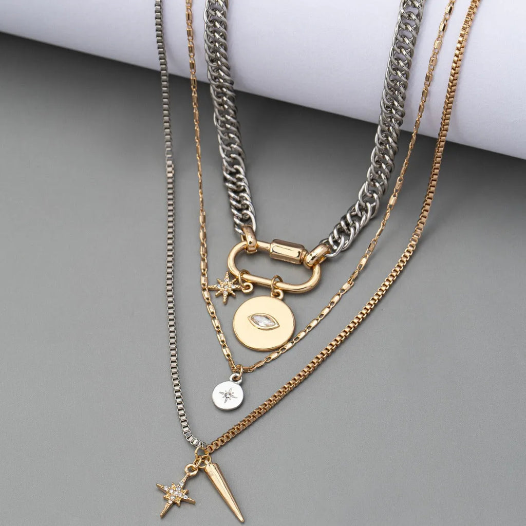 Alloy multi-layer twin necklace with geometric elliptical pendant on a white background