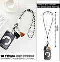 Plastic card holder with cartoon black cat design and a metal ferrule pendant attached.