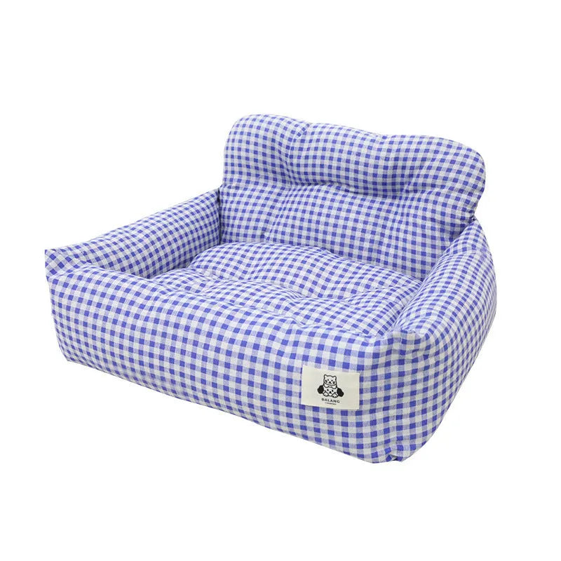 Grey and blue plaid cloth dog car travel nest carriers in two sizes for pet outings.