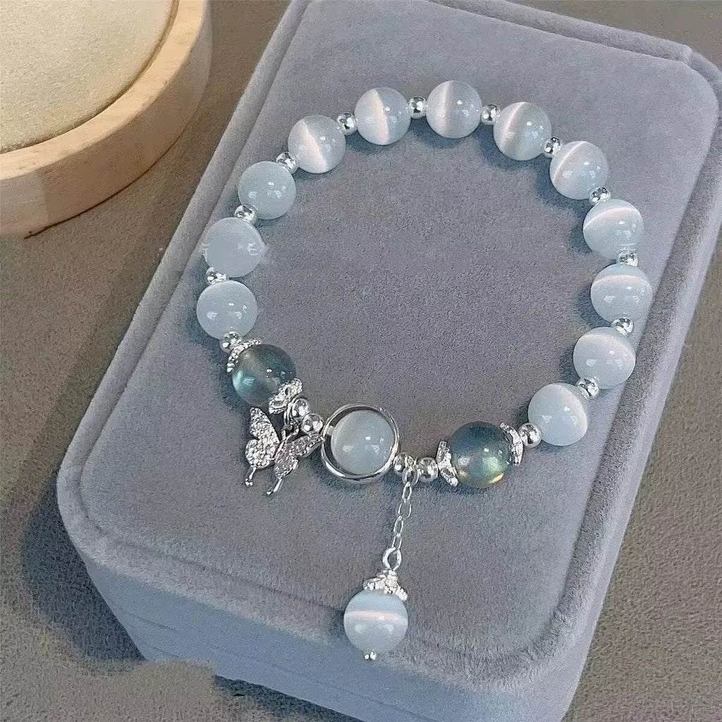 Glass butterfly bracelet for women with colour-coordinated beads in drop-shaped design