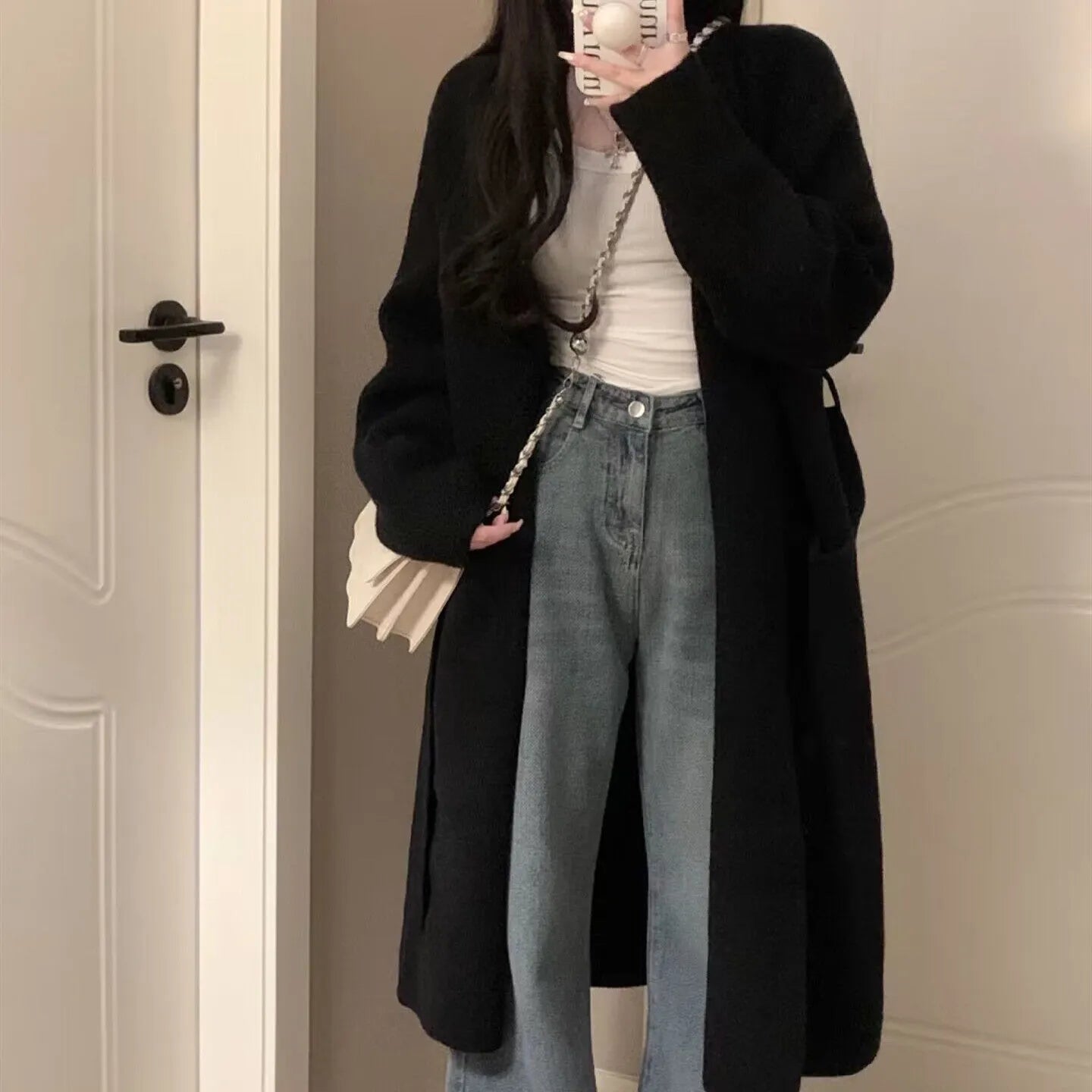 Loose thick chenille cardigan for women in a dark grey colour, showing 3D pattern and mid-length fit.