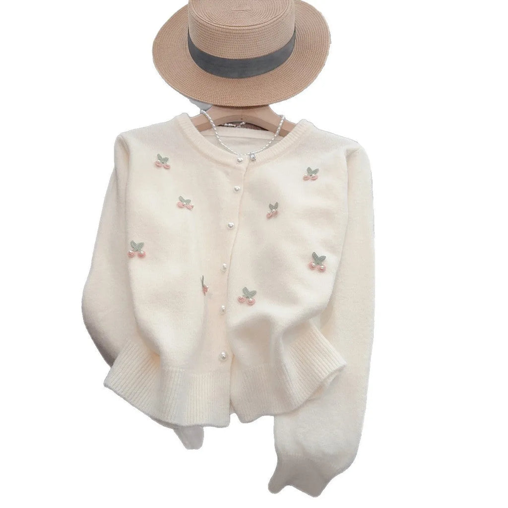 Women's cashmere cardigan with beaded detailing in pink colour showing round neck and slim fit