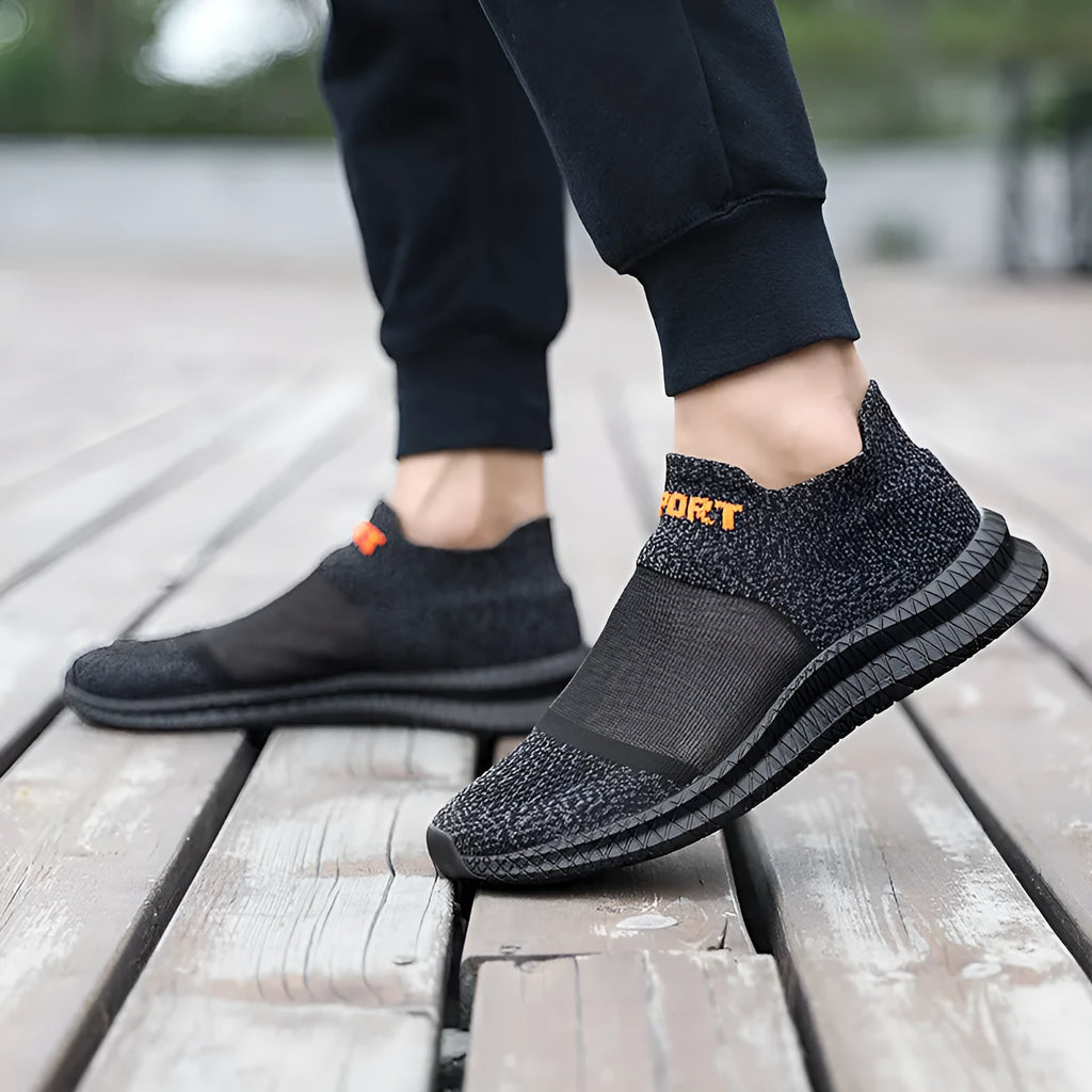 Flyknit casual sock shoes in khaki colour with lace-up front and tassel detail on a flat MD sole.