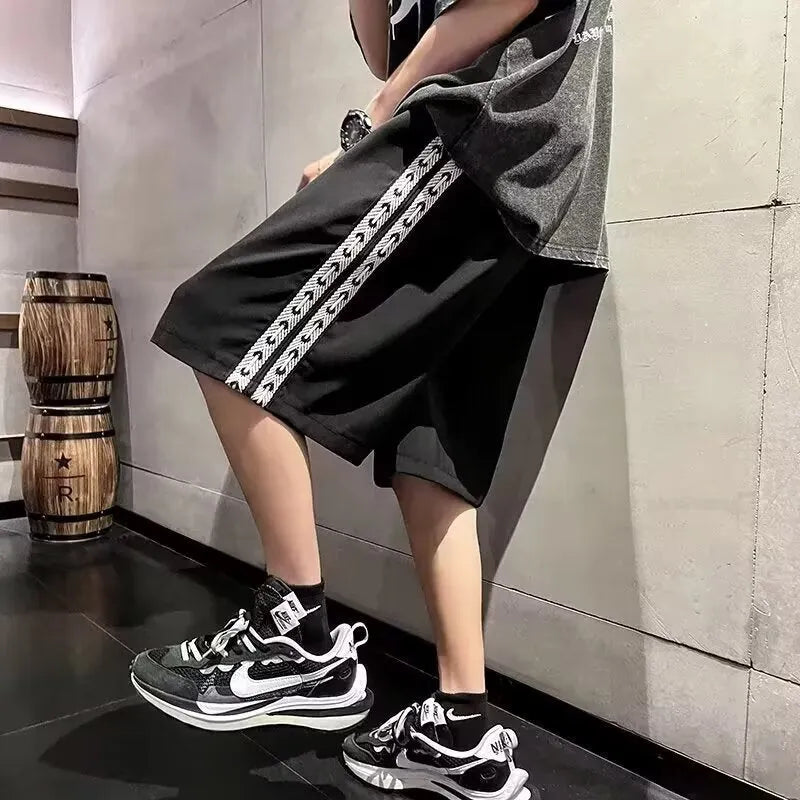 Men's black baggy track pants with micro elasticity in loose sports fit