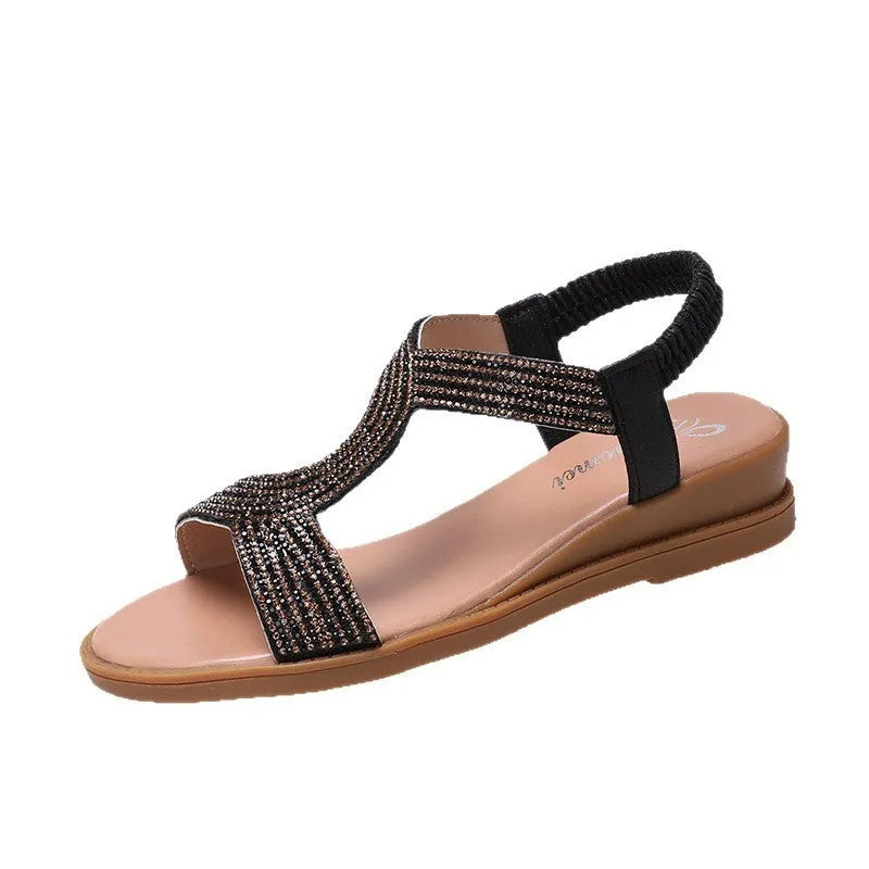 Women's patent leather beach sandals with rhinestones on a round toe, shown in gold colour.