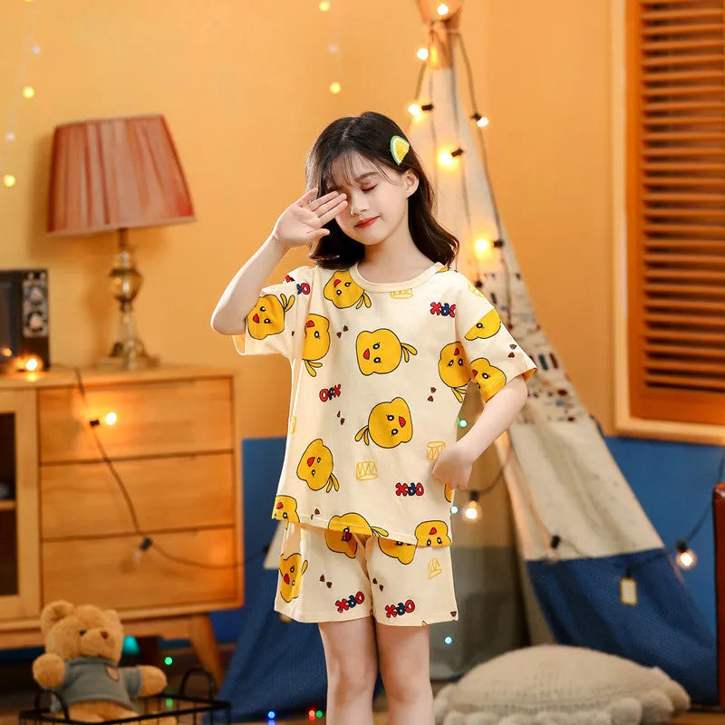 Children's cotton short-sleeved homewear set with cartoon print, top and pants, on a white background