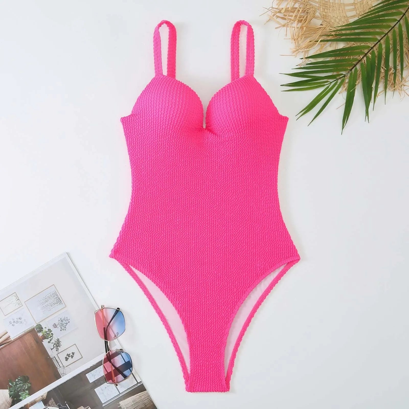 Women's black sunk stripe one-piece swimsuit made from polyester, shown on a mannequin.
