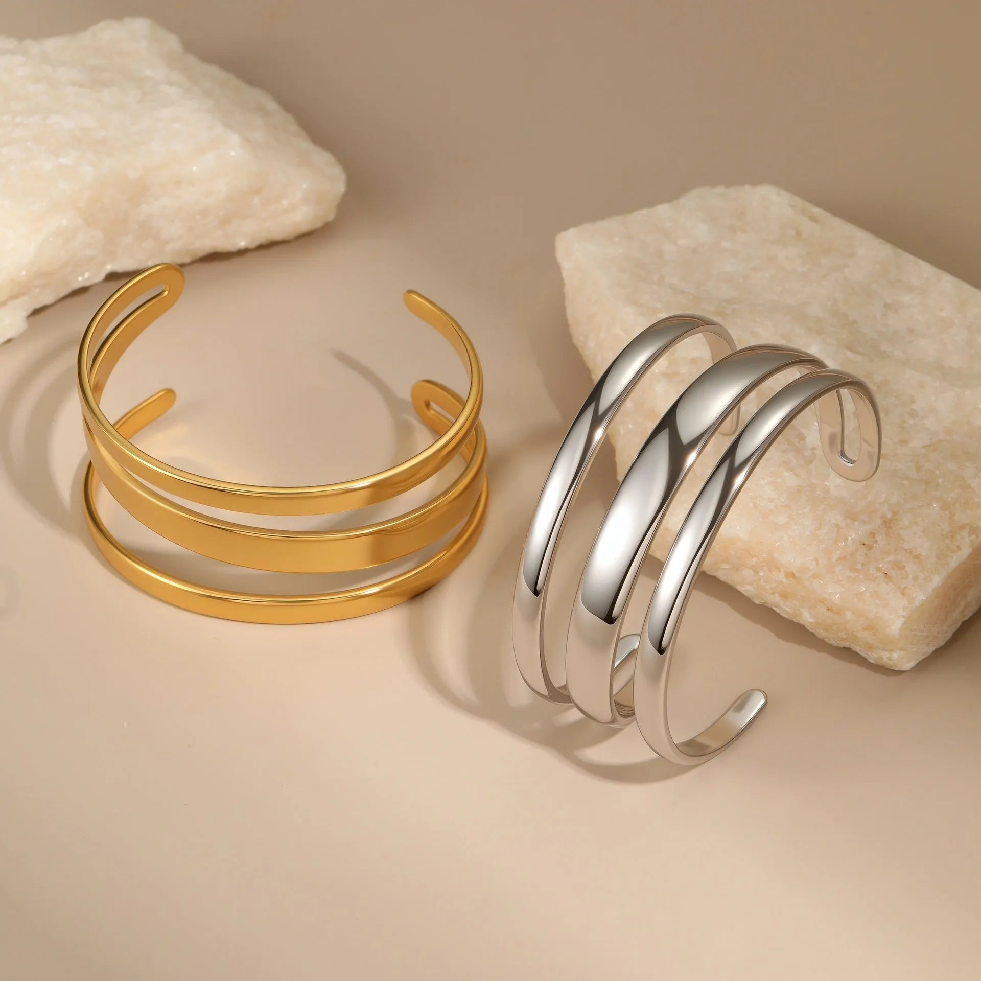 Gold and steel colour geometric line design stainless steel bracelet for women with simple opening clasp.