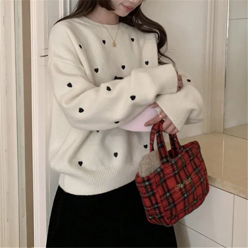 Women's loose fit acrylic pullover sweater with embroidery detail in milky white colour