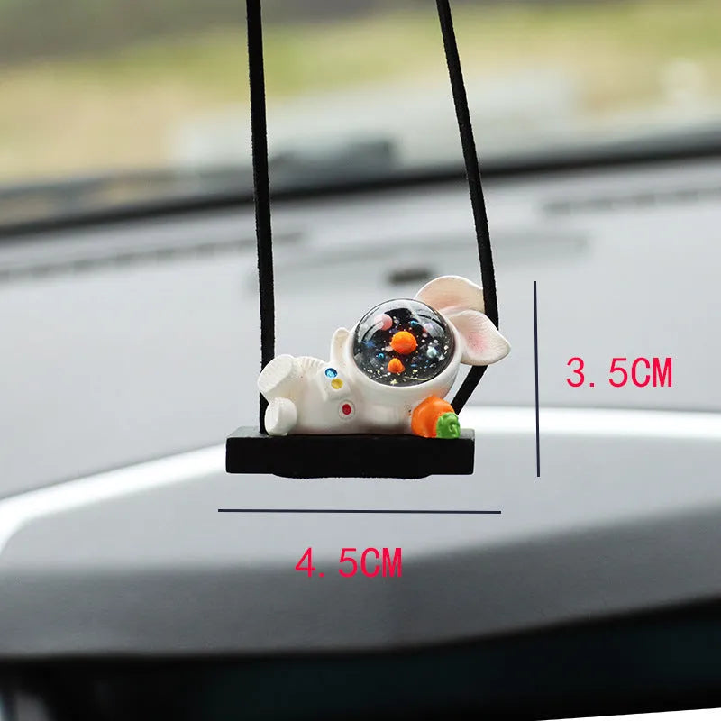 Resin cartoon astronaut car pendant decoration hanging from a rear-view mirror.