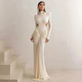 Women's slim fit long sleeve dress with high collar and pleated backless detail in light apricot colour