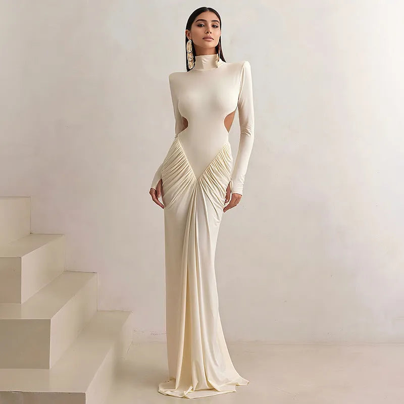 Women's slim fit long sleeve dress with high collar and pleated backless detail in light apricot colour