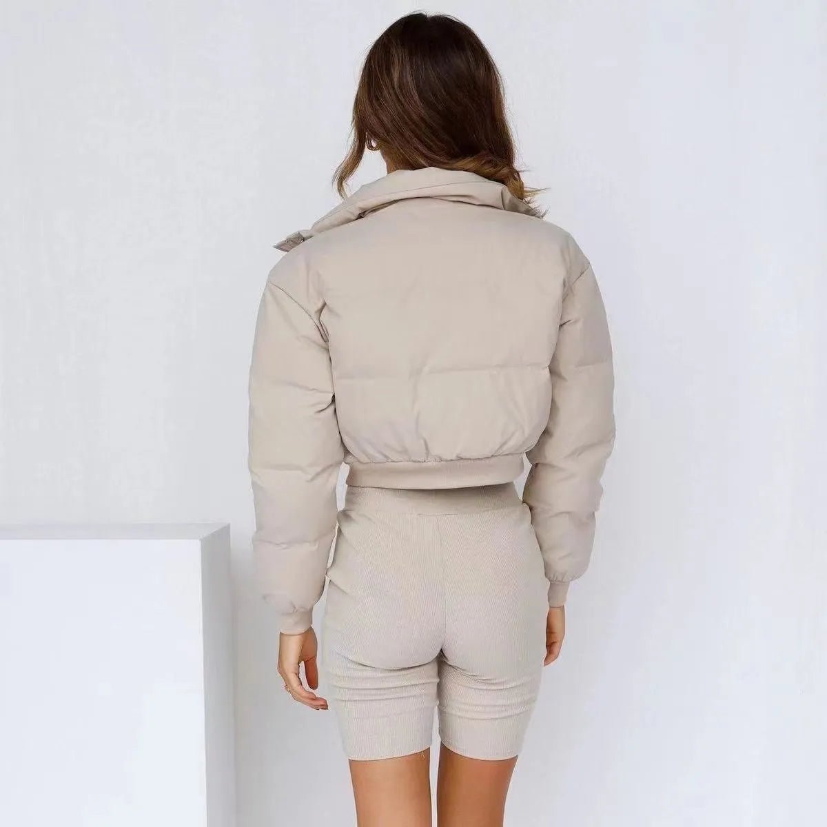 Women's loose-fit polyester jacket in blue, shown with long sleeves and a casual design.