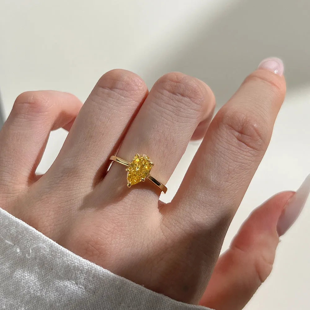 Sterling silver ring with pear-shaped high-grade zircon inlay, closed band, electroplated finish, multiple colours available