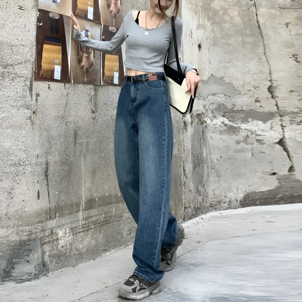Women's high-waisted retro straight jeans in medium blue denim, showing straight leg and high waist silhouette.