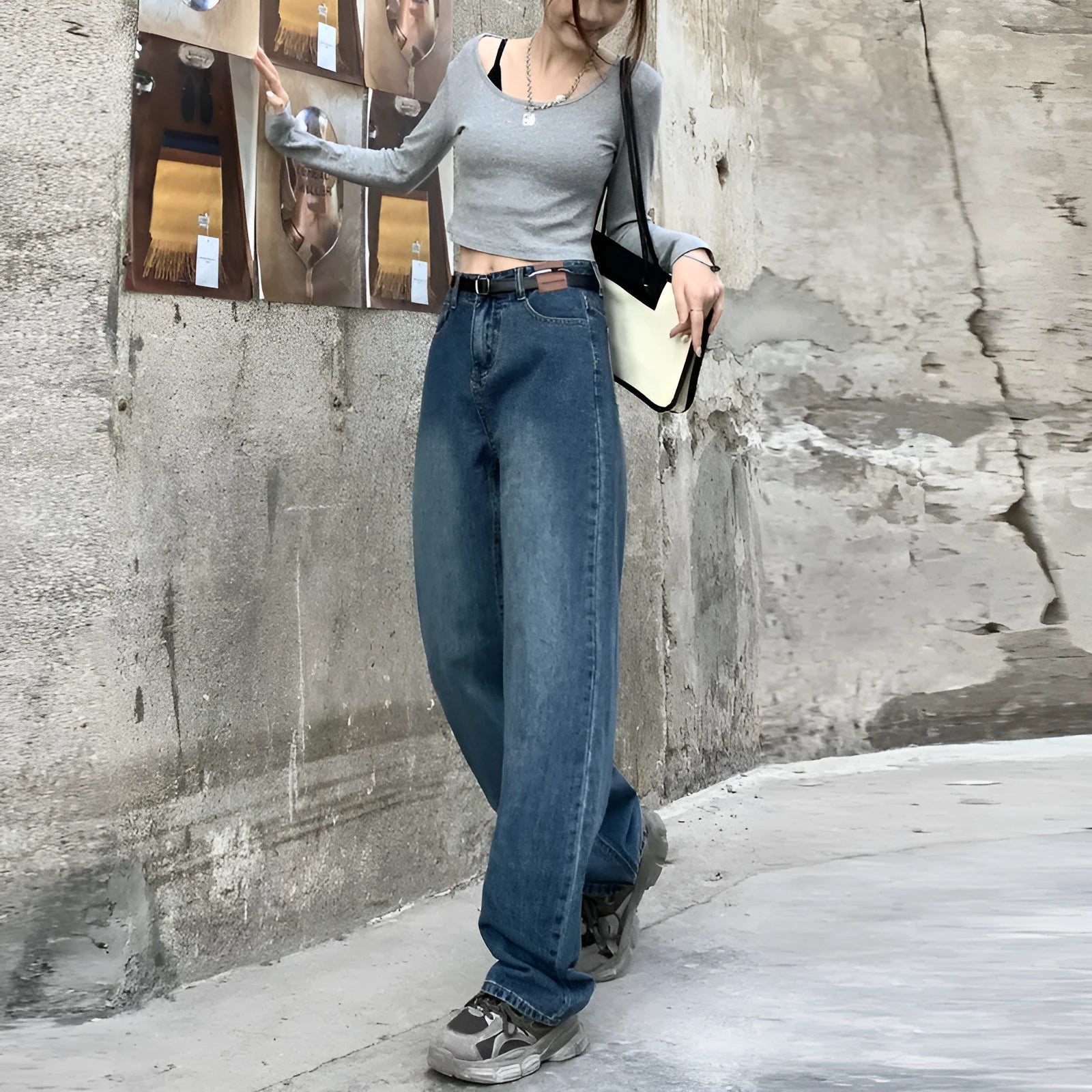 Women's high-waisted retro straight jeans in medium blue denim, showing straight leg and high waist silhouette.