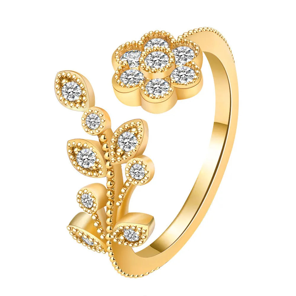 Copper open-ring with diamond-treated floral pattern and leaf details in gold colour