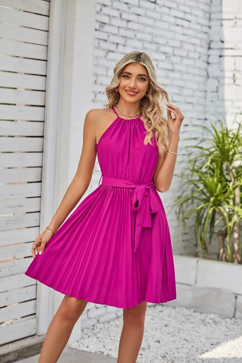Women's black halter neck strapless sundress with a pleated midi skirt and an adjustable waist belt.