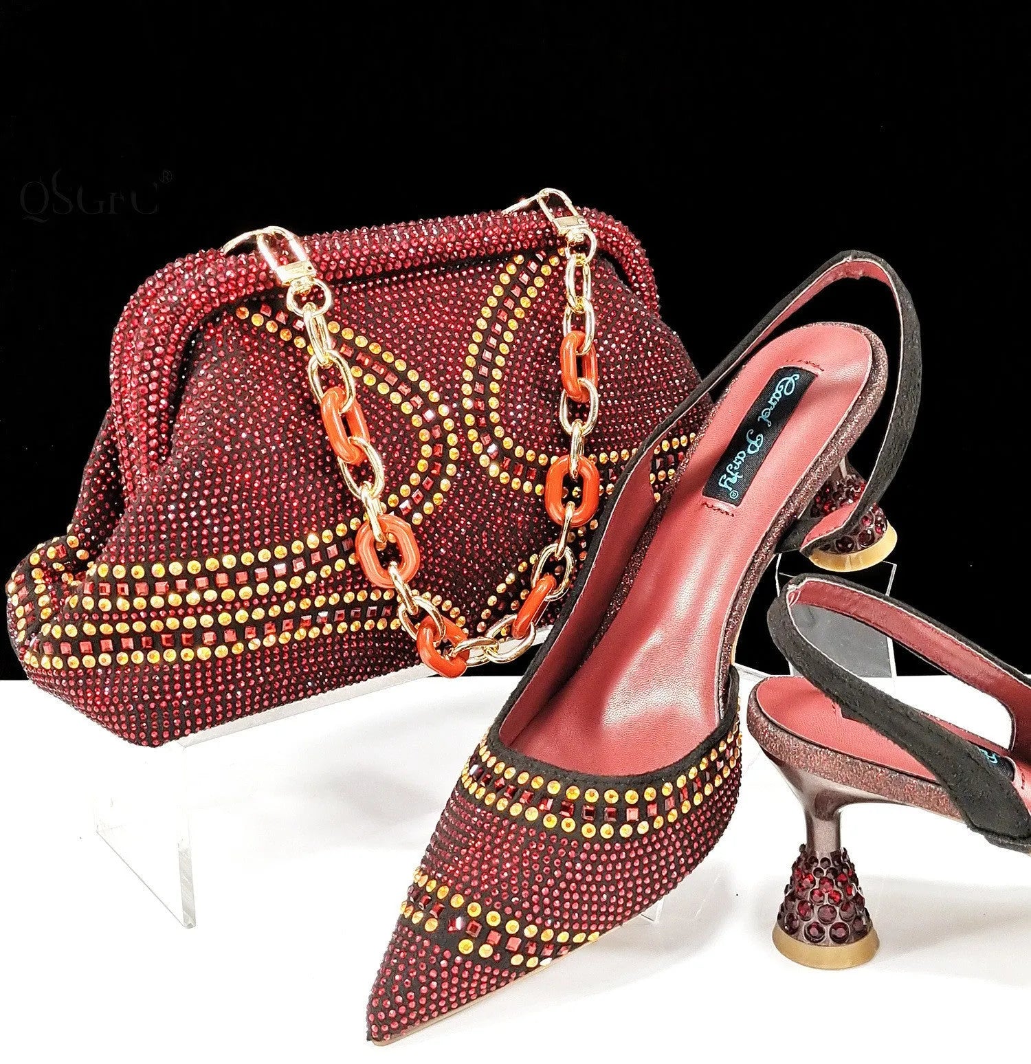 Women's pointed toe high heel shoes with rhinestone decoration and matching small bag in synthetic leather