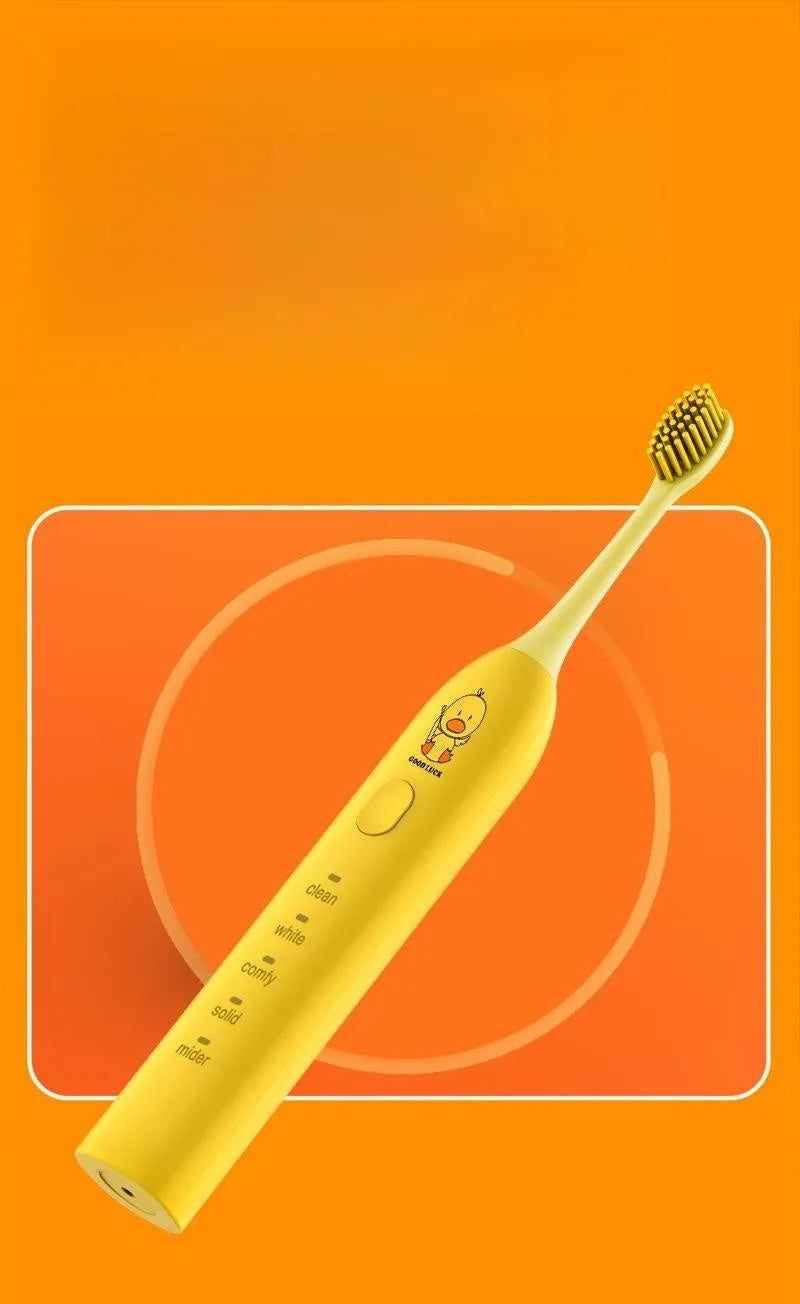 Small Yellow Duck rechargeable electric toothbrush in yellow, showing soft bristle head and USB port.