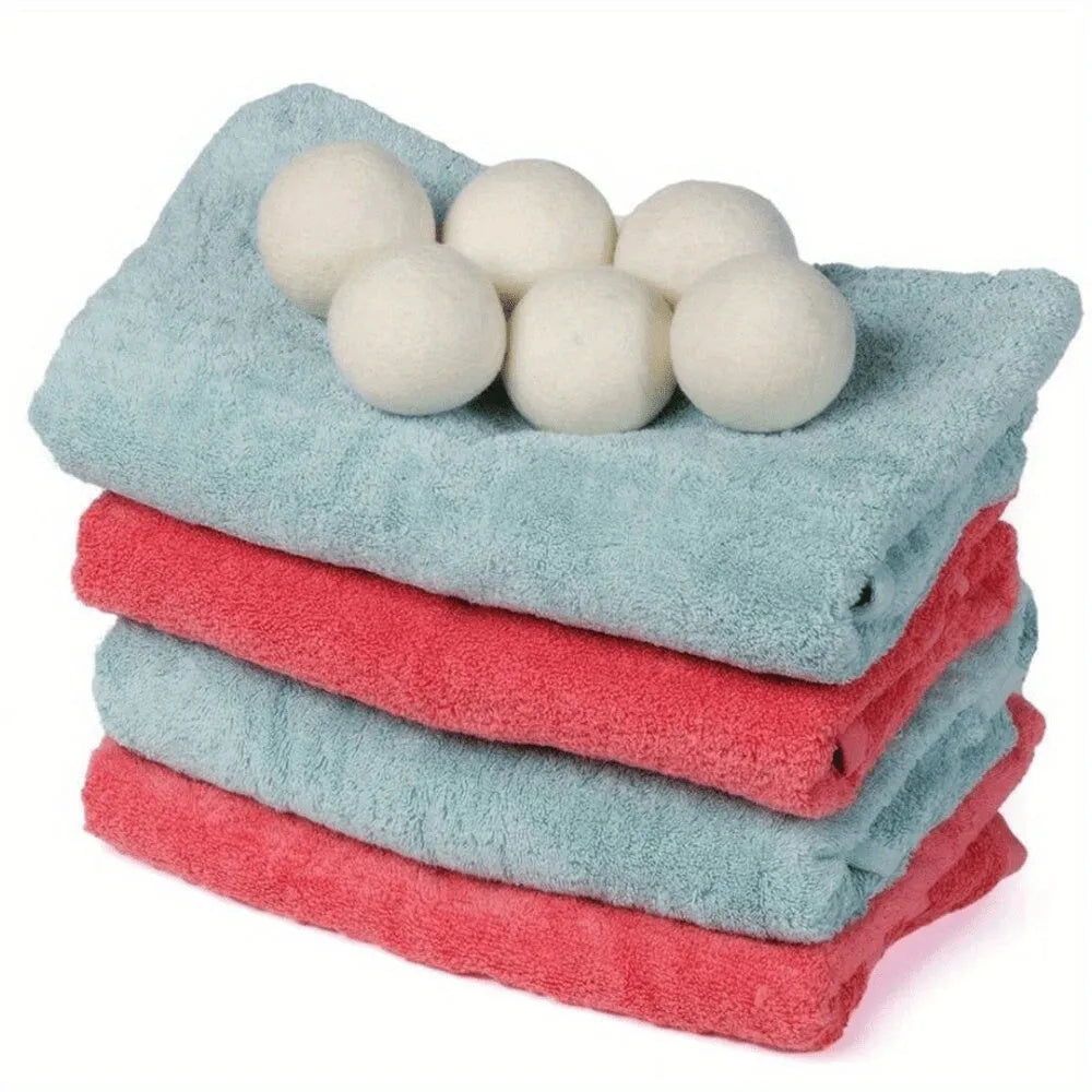 Set of six wool drying balls in three sizes 5cm 7cm 8cm for static reduction and chemical-free fabric softening