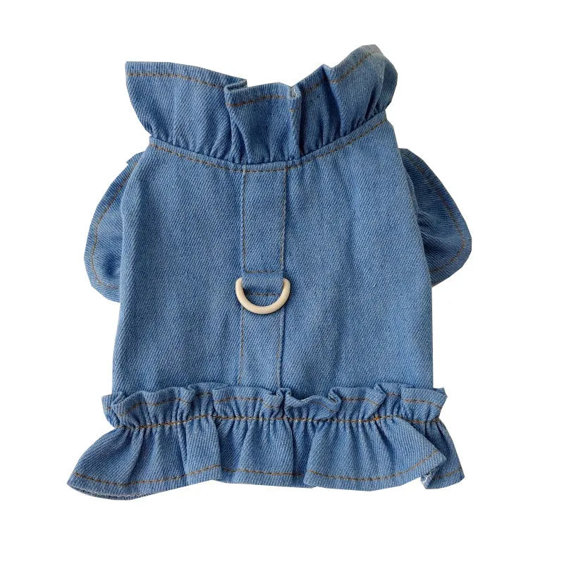 Blue denim dog dress with chest ruffles and a leash hook on the back, shown in dark blue and light blue.