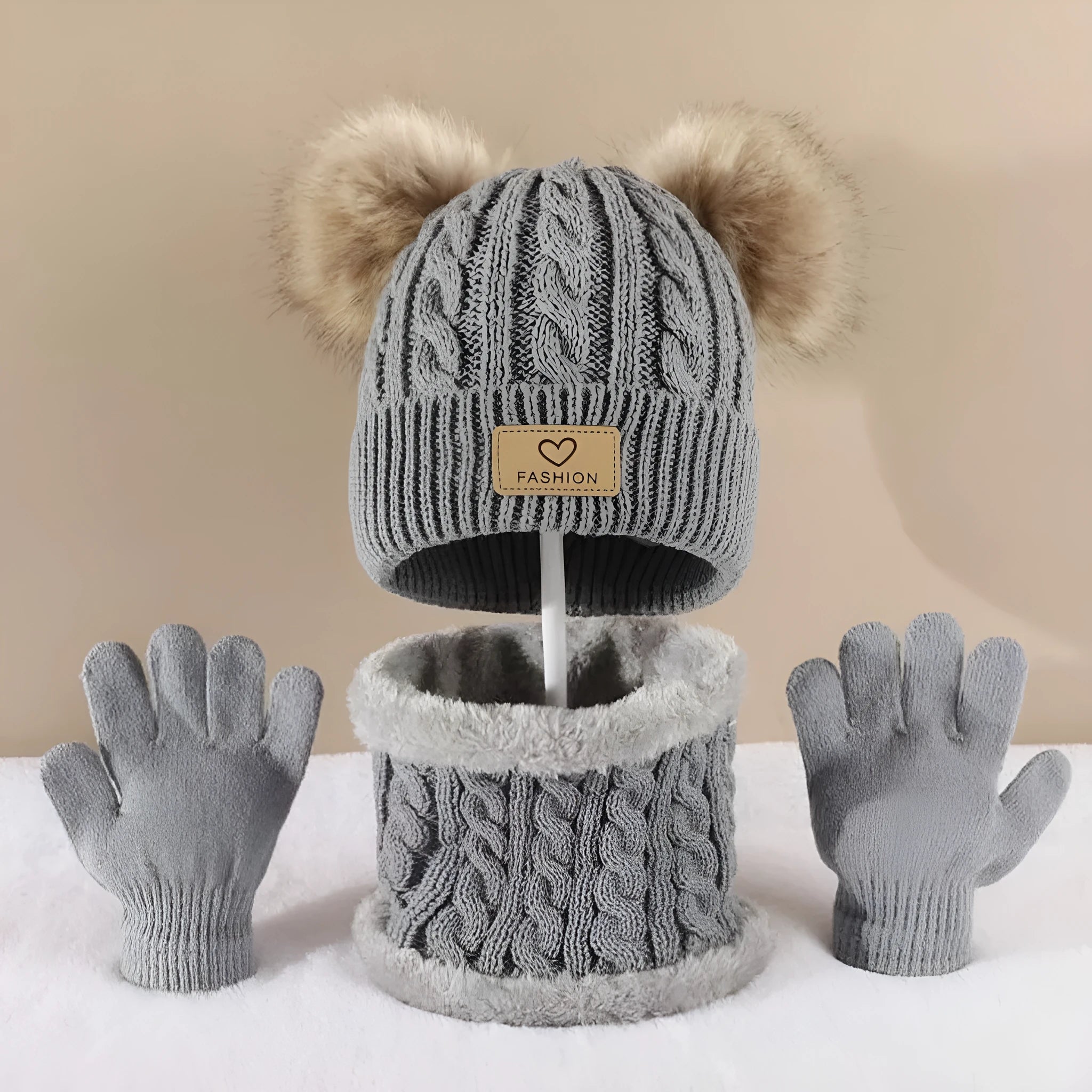Children's three-piece acrylic knit winter set with dome crown hat and matching scarf and gloves in pink