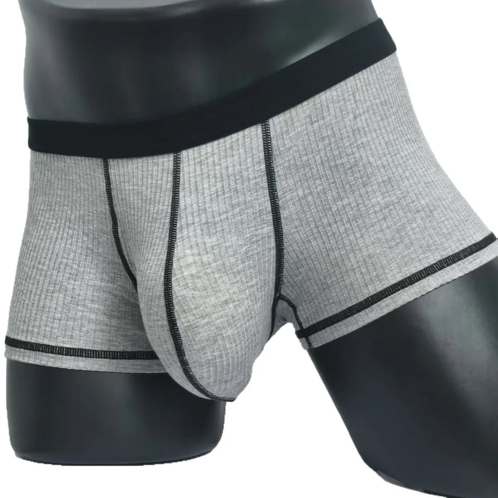 Men's solid colour breathable fibre boxer shorts shown in army green, demonstrating thin fabric and fit.