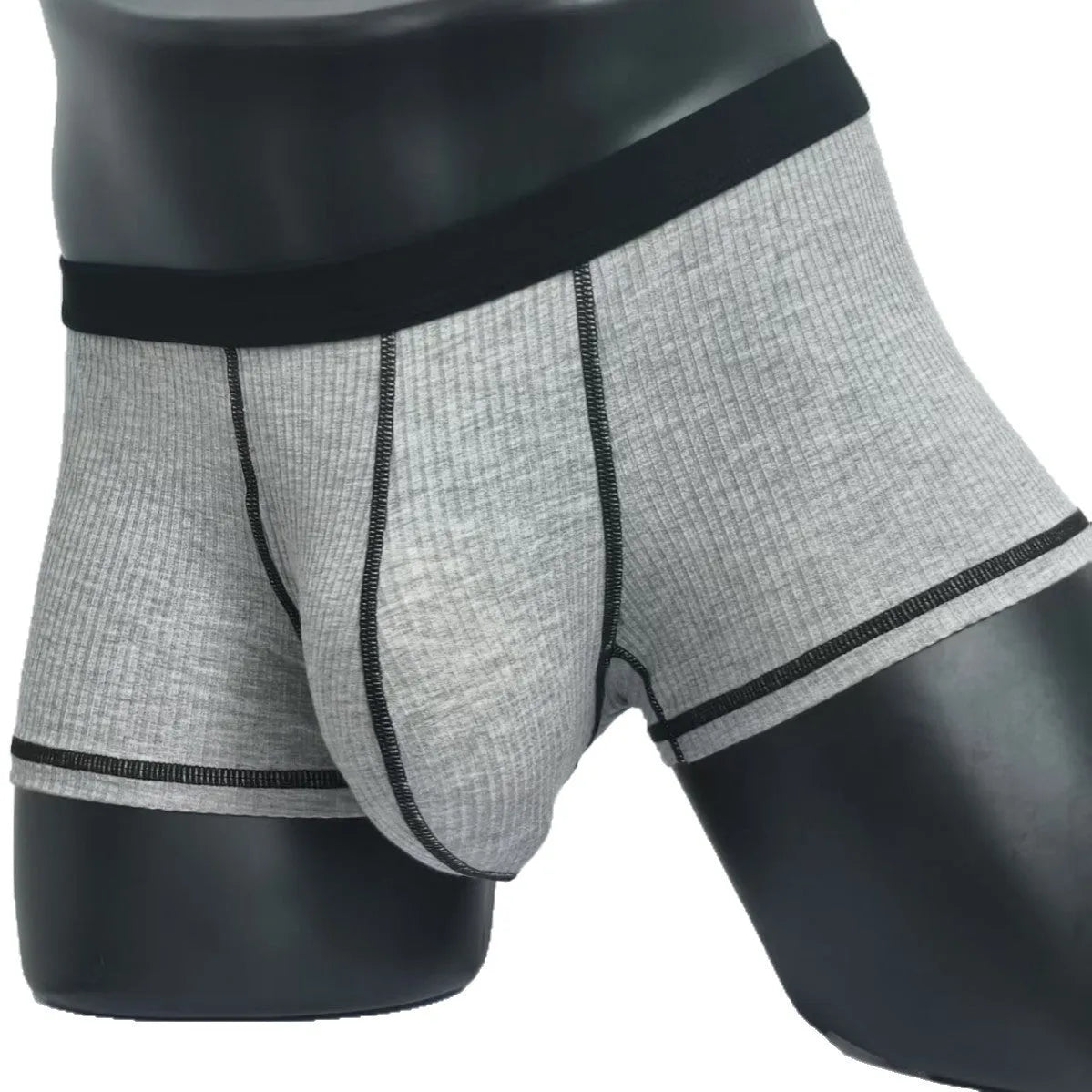Men's solid colour breathable fibre boxer shorts shown in army green, demonstrating thin fabric and fit.