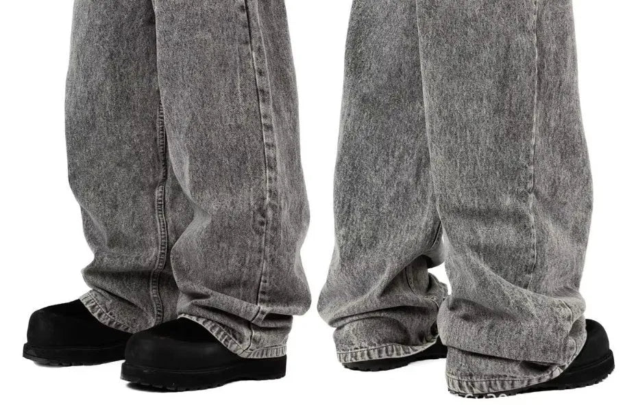 Grey loose fit straight-leg denim trousers for men on a white background