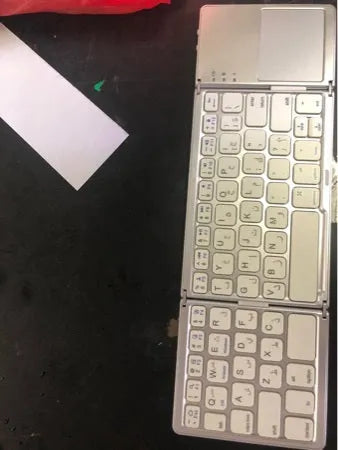 Ultra-thin black tri-fold folding Bluetooth keyboard with touchpad shown in open and closed positions