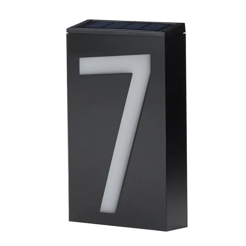 Solar powered outdoor house number light with white LEDs and wall mount.