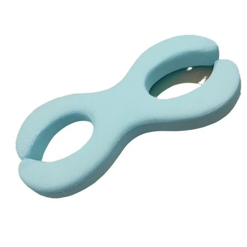 Cool blue cylindrical memory foam cervical pillow for neck support.