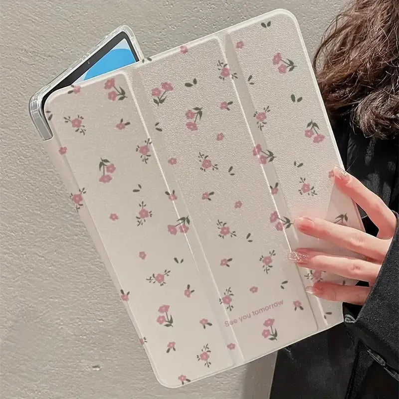 Transparent iPad case with floral cartoon pattern showing tri-fold stand position