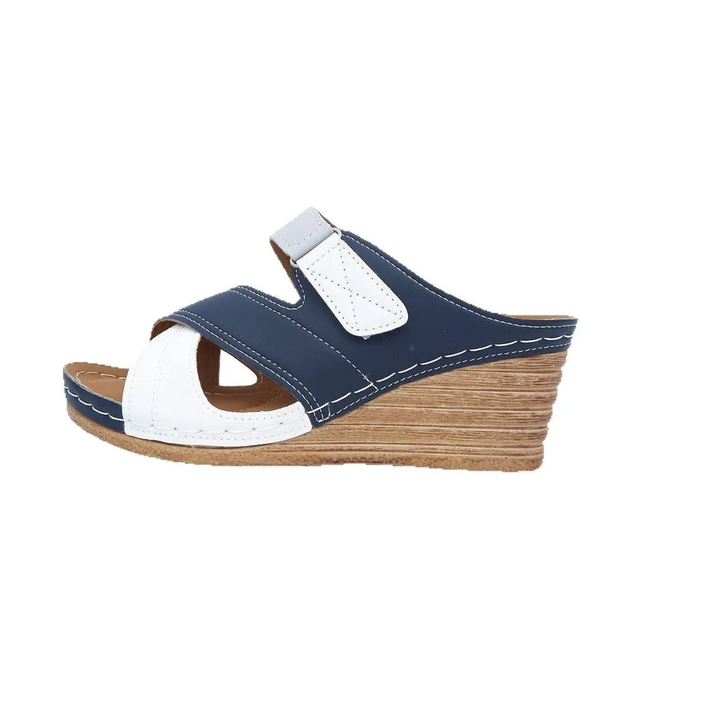 Women's wedge-heel slipper sandals with a Velcro strap, shown in a two-tone colour combination.
