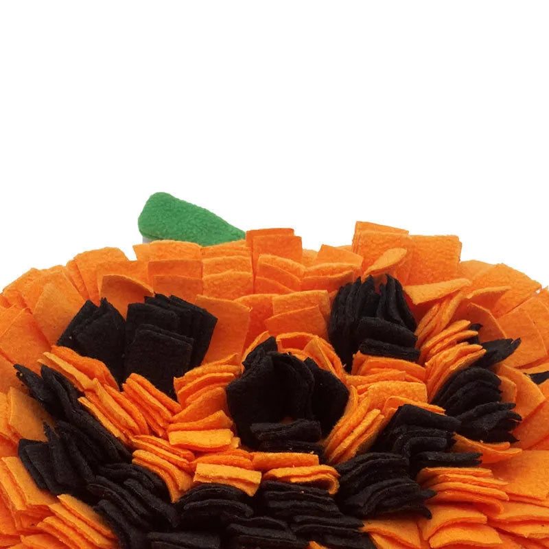 Orange pumpkin-shaped dog sniffing mat with textured fur surface for slow feeding.