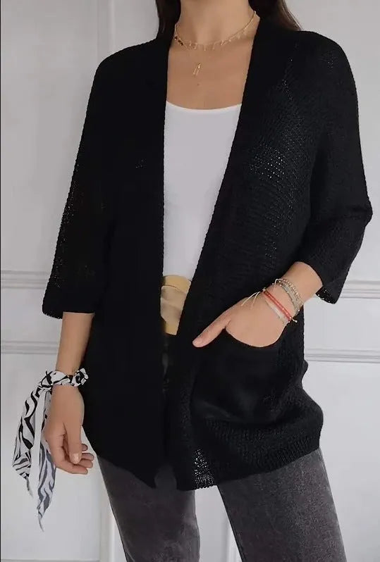 Women's army green waffle knit cardigan coat with nine-quarter sleeves and pockets.