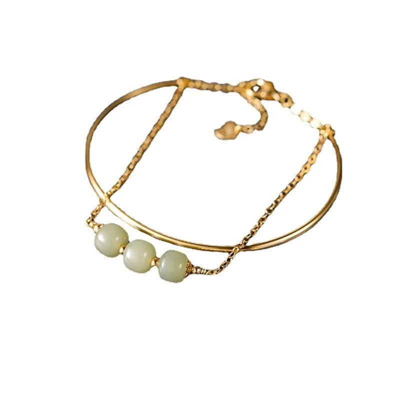 Women's Hetian jade lucky beads bracelet with gold inlay, shown in single, double, and three bead versions.