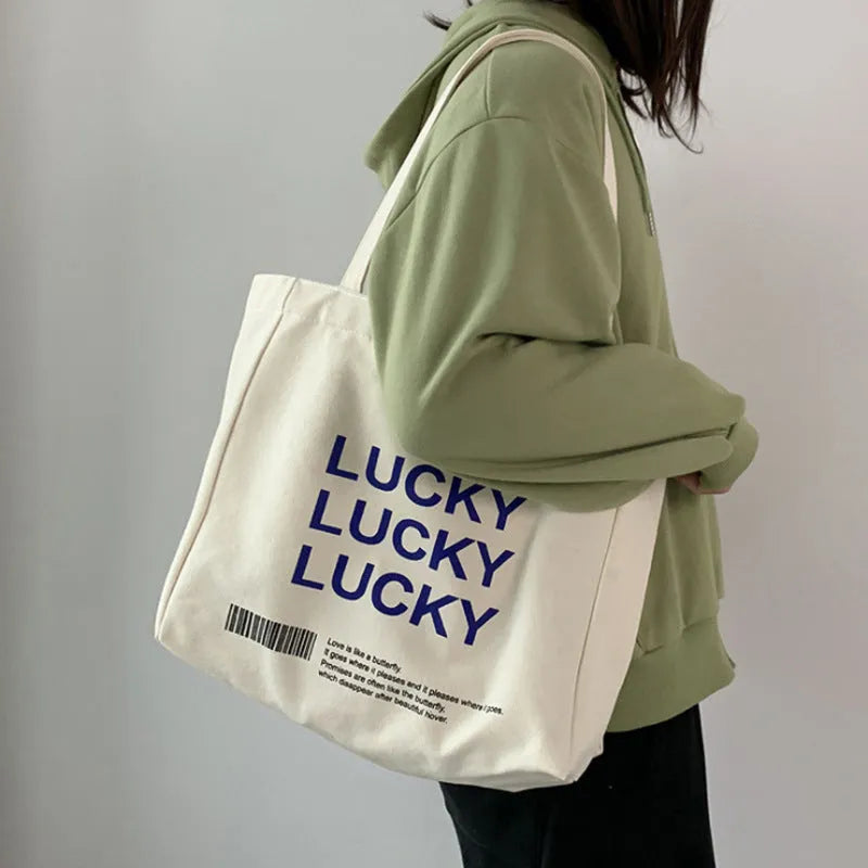 Natural colour canvas tote bag with metal magnet buckle closure and small front pocket, 32x31.5x10cm